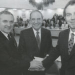 Irish Taoiseach Bertie Ahern, talks chairman George Mitchell and British Prime Minister Tony Blair shake hands after the peace deal was struck on Good Friday in Belfast.