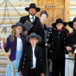 Gordon and Adrienne Clune (back) with their three children (left to right) Aine, Justin and Conor with niece Tracy (right) on their 1883 dress.