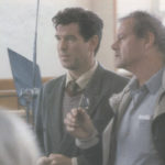 Pierce Brosnan discusses a scene with Evelyn director Bruce Beresford.