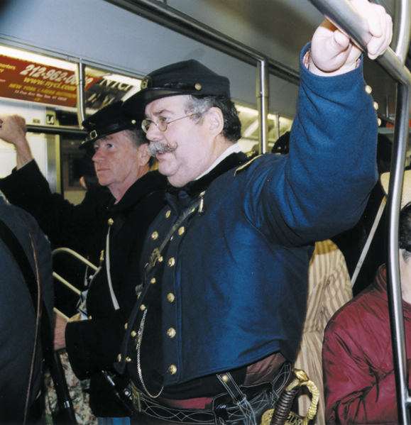 <em>Irish Brigade reenactors take the Lexington Avenue subway from the 69th Regiment Armory on 26th Street to the midtown area where the St. Patrick's Day Parade begins. Rush-hour straphangers seem unfazed by their presence.</em>