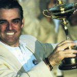 Paul McGinley holding the Ryder Cup.