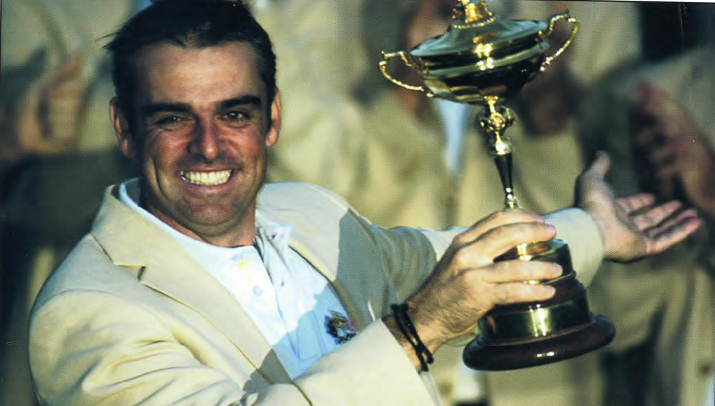 Paul McGinley holding the Ryder Cup.
