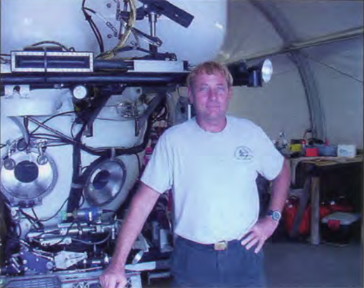 Terry Kerby standing in front of the Pisces IV.