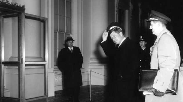 President John F. Kennedy arrives at the North Portico of the White House, Washington, D.C. on January 20, 1961 accompanied by Military Aide to the President General Chester V. Clifton. White House Secret Service agent Floyd Boring stands at left. Photo: John F. Kennedy Presidential Library and Museum.