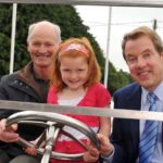 Bill Ford pictured with some Irish Fords, Henry Dan Ford and Hannah Ford O’Brien, 5, who turned out to meet him when he visited Ballinascarty, Co. Cork, birthplace of his great-great-grandfather William Ford.