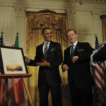 Taoiseach Enda Kenny presents President Obama with his certificate of Irish heritage.