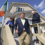 Brian Kelly, Football Coach for Notre Dame visits Breezy Point. In this photo, he brings joy to Jim McGuire, an 80-year-old resident. Photo: Peter Foley.