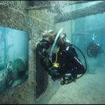 Divers tour Andreas Franke's exhibition "The Sinking World" in the USS Vandenberg. Photo: Andreas Franke.