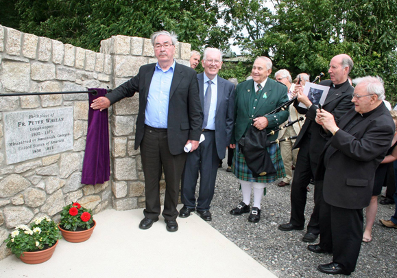 A group from Clongeen and Savannah dedicate a plaque to Fr. Whelan.