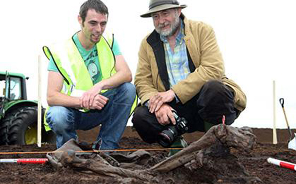 Jason Phelan, who found the prehistoric remains, and Eamon Kelly, Keeper of Irish antiquities at the National Museum at the Bord Na Móna Cashel bog outside of Portlaoise. Photo: Alf Harvey.