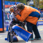 Tatyana McFadden is greeted by her mother, Debbie, at the finish line of the 2013 NYC Marathon