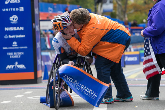 Tatyana McFadden is greeted by her mother, Debbie, at the finish line of the 2013 NYC Marathon