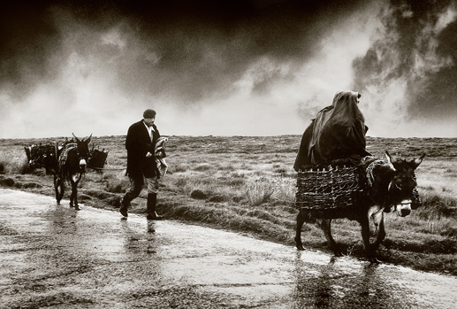 Peatcutters returning home in a rainstorm, Connemara, 1970.