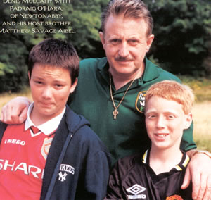 Denis Mulcahy (center) with Padraig O’Hara, of Newton Abbey, and his host brother Matthew Savage Aibel.