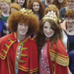 Newly crowned Redhead King and Queen, Alan Reidy and Grainne Keena, pose with a crowd full of red heads at the Irish Redhead Convention, which celebrates everything to do with red hair held in the village of Crosshaven on August 22, 2015 in Cork.