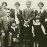 Back row, left.   Evelyn (born 1914), Anne (1913), Bridie (1908), Michael (1911), Mary (1905) Marguerite (1909), John (1916). Front row, left: Frank (1918), Michael O’Donnell (father), Leila (1925), Patrick (1924), Genevieve (1923), Margaret (Doogan) O’Donnell (mother), Philip (1920).