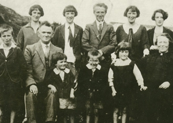 Back row, left.   Evelyn (born 1914), Anne (1913), Bridie (1908), Michael (1911), Mary (1905) Marguerite (1909), John (1916). Front row, left: Frank (1918), Michael O’Donnell (father), Leila (1925), Patrick (1924), Genevieve (1923), Margaret (Doogan) O’Donnell (mother), Philip (1920).