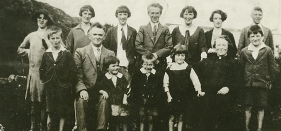 Back row, left.   Evelyn (born 1914), Anne (1913), Bridie (1908), Michael (1911), Mary (1905) Marguerite (1909), John (1916). Front row, left: Frank (1918), Michael O’Donnell (father), Leila (1925), Patrick (1924), Genevieve (1923), Margaret (Doogan) O’Donnell (mother), Philip (1920).