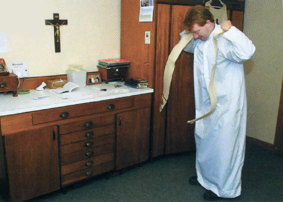 Fr. Michael Collins gets ready for mass.