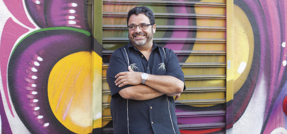 Arturo O'Farrill pictured in front of some Brooklyn street art.