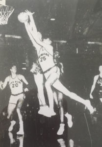 John Dearie drives around Dave DeBusschere for a Notre Dame basket. January 10, 1960. (Detroit Free Press).