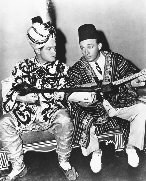 <em>Crosby with his good friend, Bob Hope, in the <strong>Road to Morocco</strong> one of the many movies they made together, paving the way for all of the "buddy" films that followed.</em>