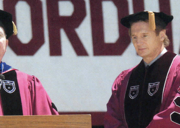 Father O'Hare with actor Liam Neeson who received an honorary Doctor of Fine Arts degree.