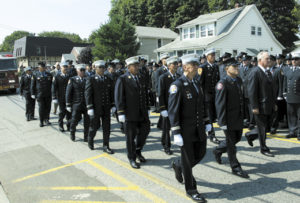 The fathers of FDNY lost on 9/11 walk together in a funeral procession.