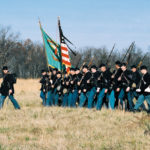 Irish Brigade reenactors retrace the steps of the 69th New York State Volunteers through the Wheatfield at Gettysburg on Remembrance Day, Nov. 2002 - photo by Jim Maher.