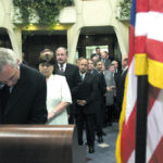 Taoisearch Bernie Ahern and Tanaiste Mary Harney with members of the Irish Cabinet sign the book of condolences in the US Embassy in Dublin three days after the terrorist attacks.