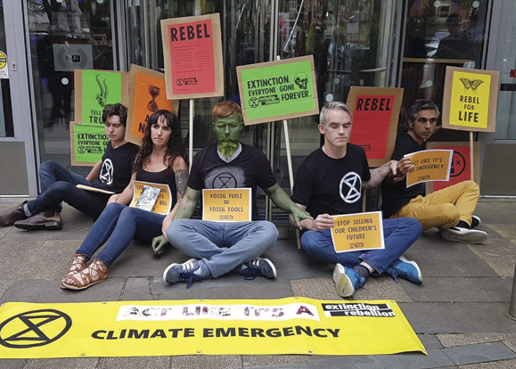 The climate action campaign group Extinction Rebellion Ireland stage a sitdown in Dublin on July 16.