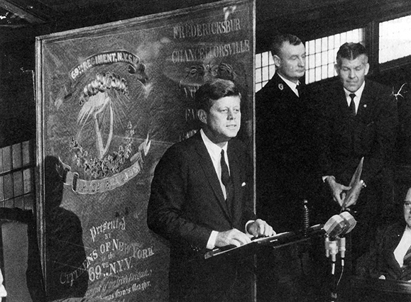 Photo of President John F. Kennedy presented the 69th New York's restored second color to the Irish people in June 1963.