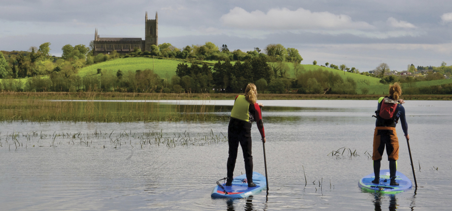 Pam Martin and Eddie Hawkins of Wild Rover Adventures paddle the River Quoile towards Down Cathedral, where St. Patrick is buried.