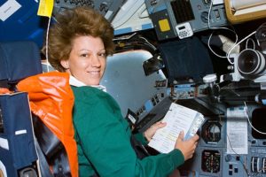 Eileen Collinsa at the commander's station on Space Shuttle Columbia on the first day of the STS-93 mission
