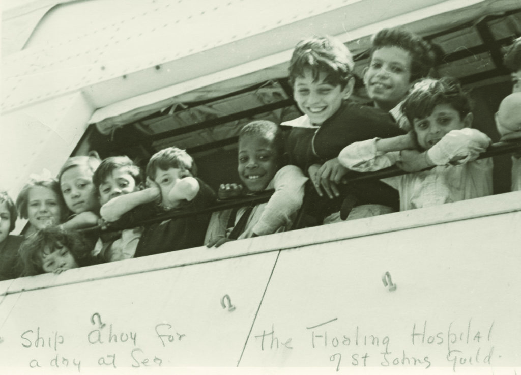 “Ship ahoy for a day at sea.” A group of young patients enjoy a day of sailing in 1935.