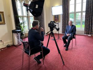 Kelly Candaele, Irish America contributor interviews Senator George Mitchell in Belfast for the 25th anniversary of the Good Friday Agreement.