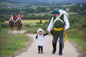 Rebels and Redcoats prepare for Battle. Pictured is Rebel Ray Murphy with his granddaughter Emily 2yrs on their way to Vinegar Hill. Photograph Patrick Browne.