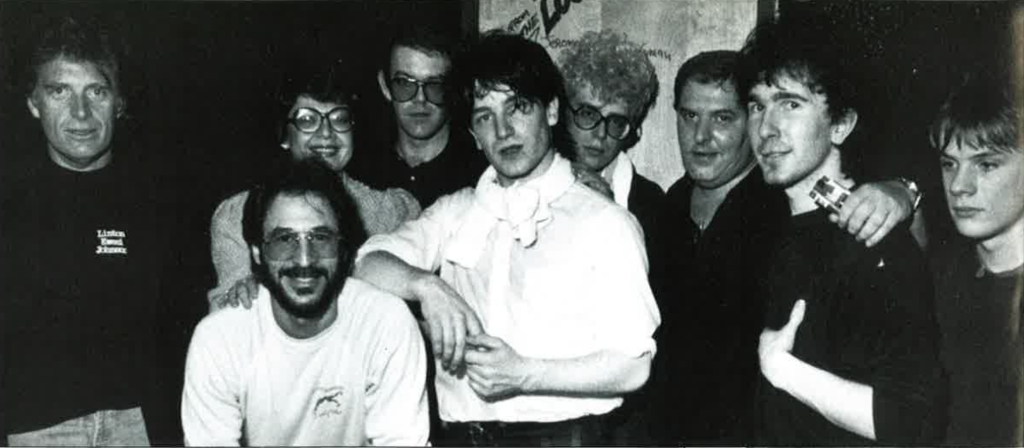 Blackwell (left) pictured with U2, (and unidentified others) in 1980, says of their audition, "They didn't play that great but there was a passion about them, they were real, nothing fake."