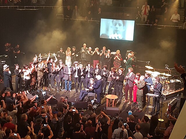 Shane MacGowan received a Lifetime Achievement Award from the President of Ireland, Michael D. Higgins, in the National Concert Hall, Dublin, on 15th November 2018. Photo: Wikipedia