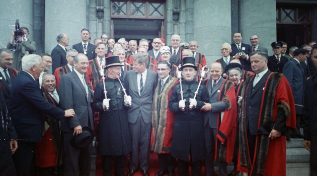 President John F. Kennedy (center) poses with members of the Cork Corporation outside City Hall in Cork, Ireland. Photo jfk.artifacts.archives.gov