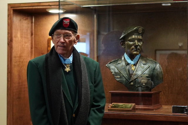 Colonel Roger Donlon with the bust created by Douwe Blumberg. Donlon donated his Medal of Honor and it now has a permanent place on the statue.