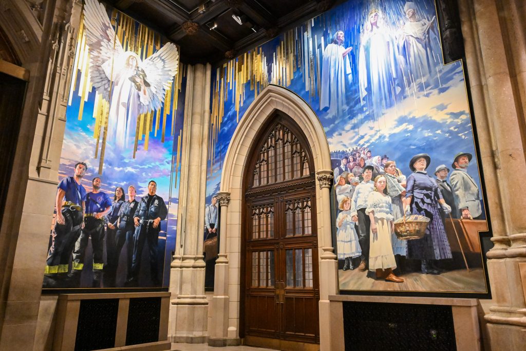 A new mural painted by artist Adam Cvijanovic, the north and west panels seen here, was unveiled at St. Patrick's Cathedral on Wednesday, Sept. 17, 2025, in New York. The mural, which is the largest permanent artwork commissioned for the cathedral in its 146-year history, celebrates the 1879 Apparition at Knock, Ireland, the faith of generations of immigrants to New York, and the service of New York City's first responders. (Diane Bondareff/AP Content Services for the Archdiocese of New York)