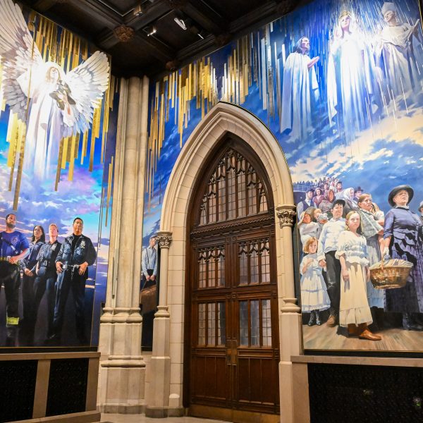 A new mural painted by artist Adam Cvijanovic, the north and west panels seen here, was unveiled at St. Patrick's Cathedral on Wednesday, Sept. 17, 2025, in New York. The mural, which is the largest permanent artwork commissioned for the cathedral in its 146-year history, celebrates the 1879 Apparition at Knock, Ireland, the faith of generations of immigrants to New York, and the service of New York City's first responders. (Diane Bondareff/AP Content Services for the Archdiocese of New York)
