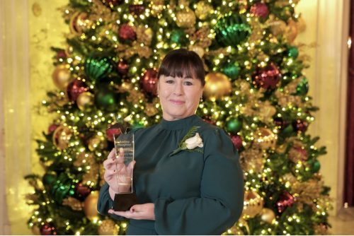 Andrea with award - tree horizontal